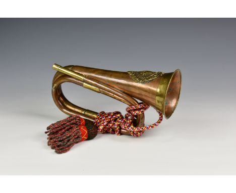 A copper and brass Argyle and Sutherland bugle and tassel, lacks mouthpiece.