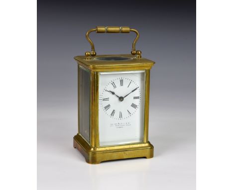 A gilt brass carriage clock, early 20th century, corniche case, white enamel Roman dial, signed by the retailer 'James Hardy 