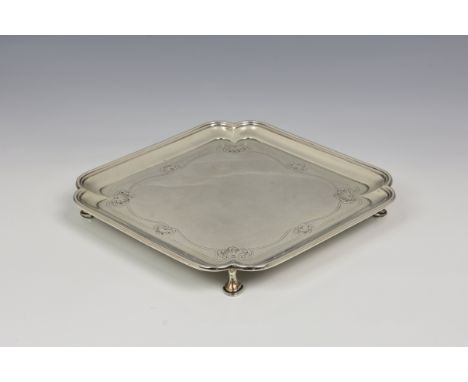 A square George V silver waiter / salver, Thomas Bradbury & Sons Ltd, Sheffield, 1921, of square form with scalloped corners,