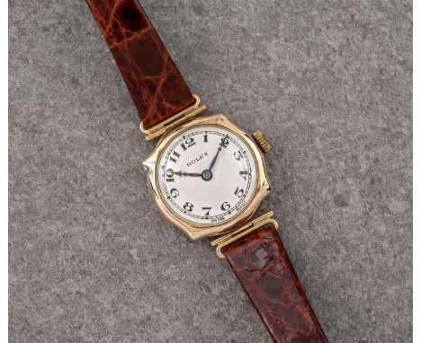 An antique 9ct yellow gold Rolex wrist watch, 1920s-30s, the 24mm. 9ct gold shaped square case signed '9C Rolex 7 World's Rec