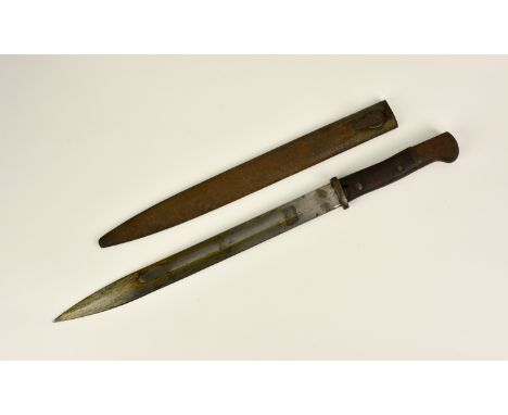 A German M 1914 type 1 bayonet, by Fredrich Plucker, fullered blade, FP in oval on ricasso, wooden grip with metal mounts, me