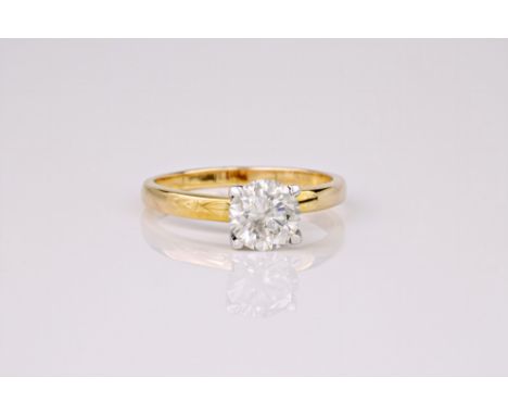 A diamond solitaire ring, the round cut diamond weighing approximately 1ct and set in a 9ct yellow gold band. Ring size M.* C