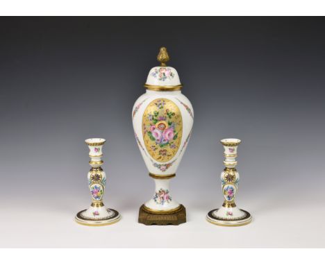 A Limoges porcelain vase and cover, mid-20th century, with gilt brass mounts, ovoid form, decorated with floral reserves and 