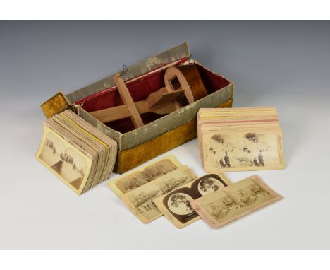 A stereoscopic viewer and quantity of cards, to include many comical scenes comprising of five by Littleton View Co - 1425 Pi