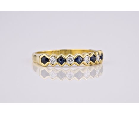 An 18ct yellow gold, sapphire and diamond half eternity ring, with alternate round cut sapphires and brilliant cut diamonds, 