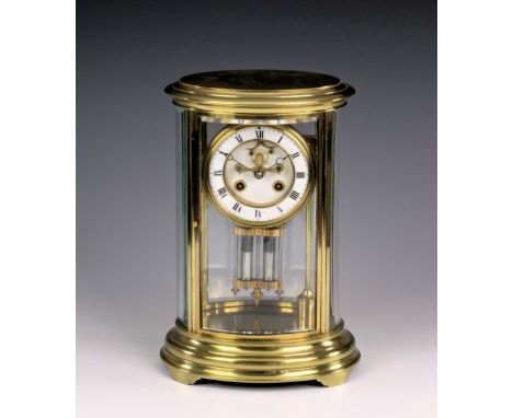 A French oval gilt brass four glass mantel clock by J. Marti &amp; Cie, with white Roman enamel chapter ring and outside Broc