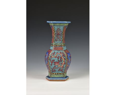 A Chinese stoneware hexagonal baluster vase, probably 19th / early 20th century, the powder blue glazed vase extensively enam