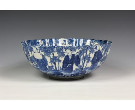 A Japanese blue and white scalloped edge punch bowl, probably early 20th century, with continuous scenery of Japanese Scholar