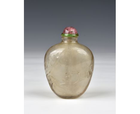 A Chinese cottonwool rock crystal snuff bottle, probably 19th century, of high shouldered, ovoid form, one side carved with a