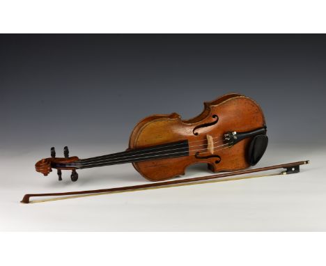 A 19th century violin, the inside of the body labelled 'Carlo Antonio Testore figlio Maggiore del fu Carlo Giuseppe in Contra