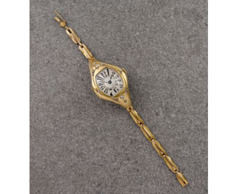An Art Deco 18ct gold ladies wrist watch, 1930s-40s, the silvered tonneau shaped dial with 'watered' decoration, stylised Ara