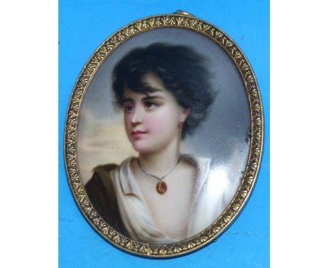 An oval miniature on china:  head and shoulders portrait of a young woman with locket, in gilt frame, height 3¼"