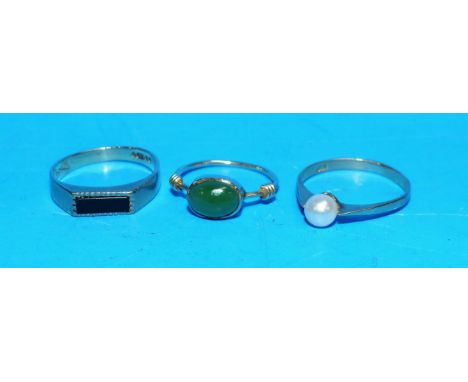 Three 9 carat hallmarked gold rings:  one set black stone; one set with a pearl; one set jade coloured stone 