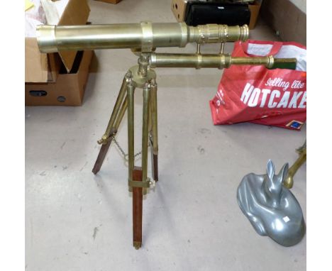 A mid/late 20th century brass telescope on brass and hardwood tripod