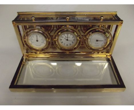 Brass gimbal nautical style clock by Aquascutum with hydrometer and thermometer