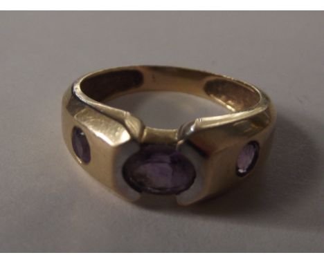 9 carat gold dress ring set with three amethyst, size R, weight 4 grams