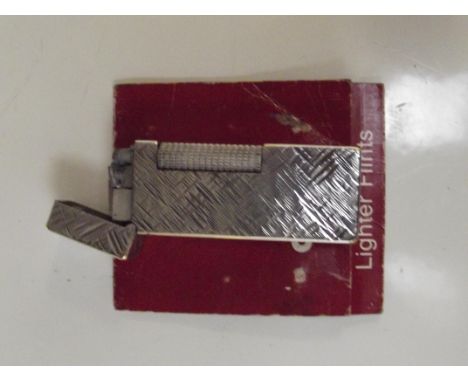 Vintage Dunhill cigarette lighter with additional flints
