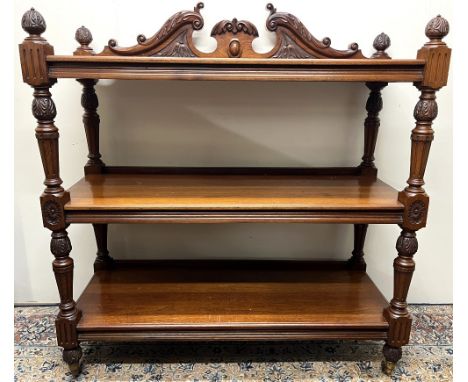 Victorian walnut buffet, with swan neck cresting, the three rectangular tiers on acanthus carved turned tapering supports wit