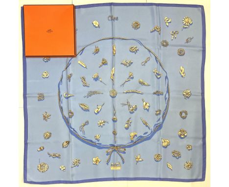 Hermes silk scarf, 'Clips', designed by Vladimir Rybaltchenko c1986, c2004 reissue, gold clips on a pale blue ground, hand ro