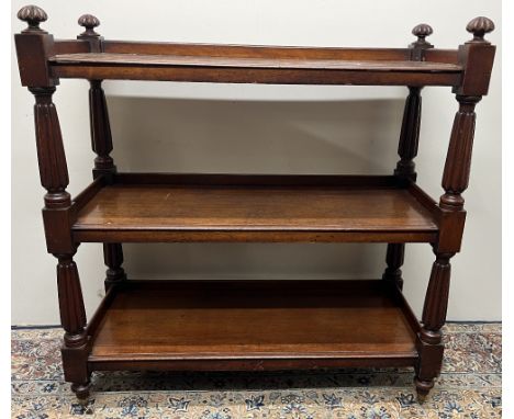 William 1V mahogany buffet, three rectangular tiers on lobed tapering supports with similar finials, mushroom turned feet wit