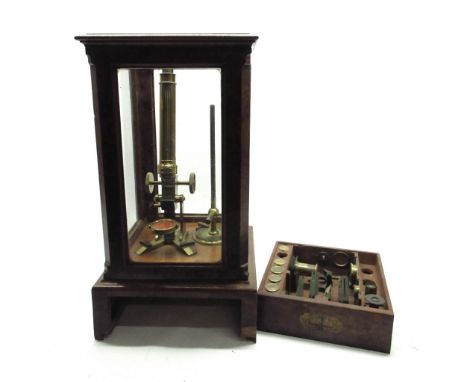 19th century Amadio brass monocular microscope with coarse and fine rack and pinion adjust and two eyepiece lenses, on shaped