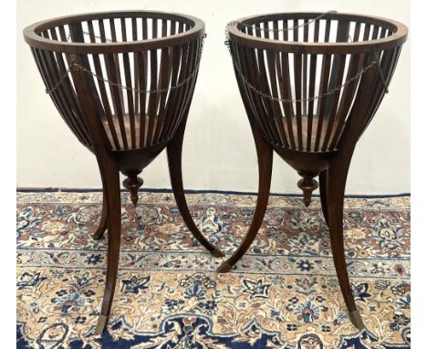 Pair of Regency Revival openwork urn shaped tripod jardiniere, with turned finials on slender square tapered brass capped sab