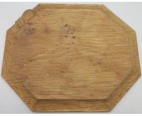 Robert Mouseman Thompson of Kilburn - an oak octagonal bread board with with carved signature mouse, L31cm 