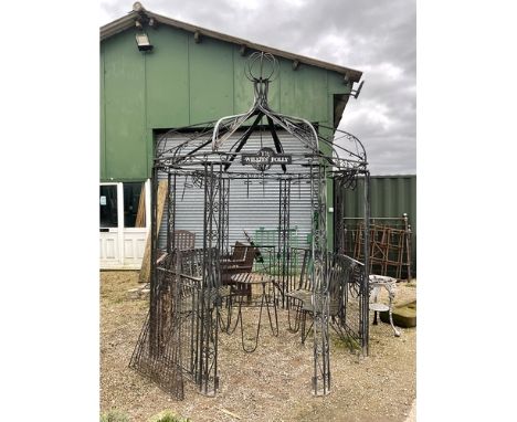 Large ornate Victorian style steel pergola gazebo with seating and table to match. With plant hanging accessories and spiral 