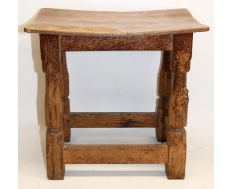 Robert Mouseman Thompson of Kilburn - an oak joint type stool, nailed rectangular adzed dished top on faceted supports, carve