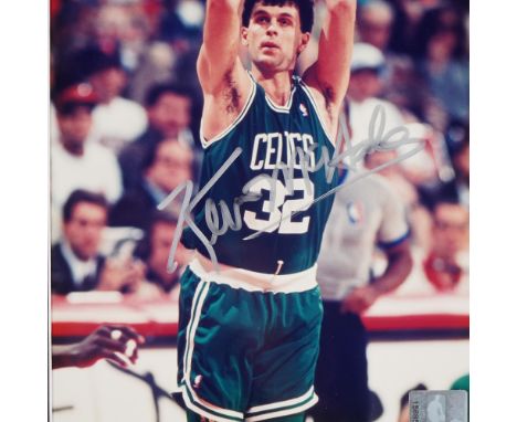 Framed color photo of Boston Celtics legend Kevin McHale in game action, signed in silver ink. The image is professionally ma