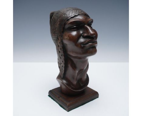 Finely hand-carved wooden bust of a Inca warrior figure, adorned with a detailed patterned headdress, featuring incised geome