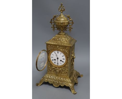 A cased brass mantel clock height 47cm