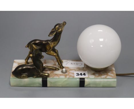 An Art Deco figural lamp, decorated with deer