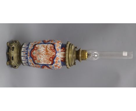 An Imari vase converted to an oil lamp