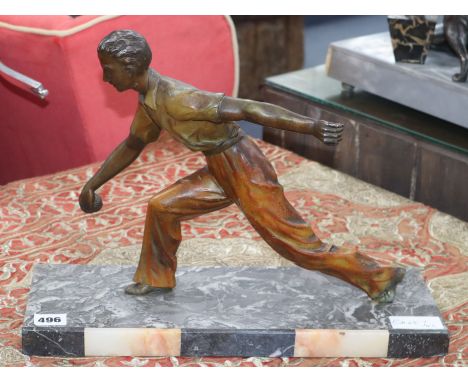 An Art Deco patinated bronze figure of a boules player, signed "Limousin", length 41cm