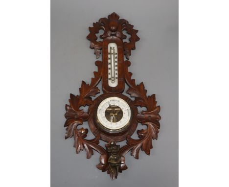A late 19th century German carved walnut barometer and thermometer, by Rudolph Strange, Bunde and a Satsuma earthenware vase 