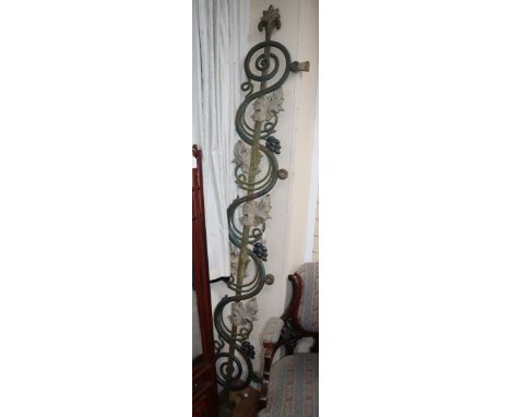 A cast iron Victorian gate pediment, decorated with vine leaves and bunches of grapes W.225cm