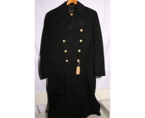 British Naval dress uniform long black overcoat with shoulder boards having bullion crown, bullion eight pointed star and cro