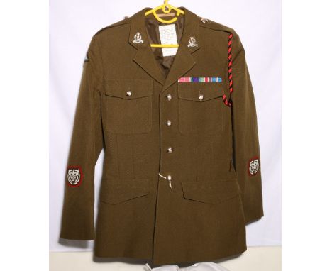 British Army dress uniform khaki green jacket with J Compton Sons and Webb Ltd label with Adjutant Generals Corps insignia in