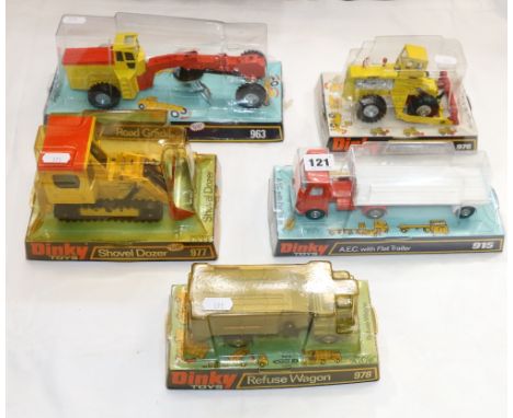 Five Dinky Toys diecast metal models including 915 AEC with Flat Trailer, 963 Road Grader, 976 Michigan 180-111 Tractor Dozer