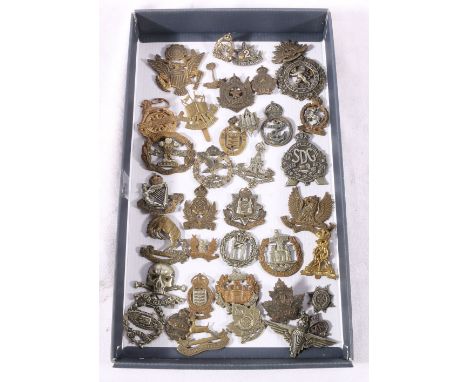 Military cap and collar badges including 17th/21st Lancers Death or Glory badge, Royal Tank Regiment Fear Naught badge, Royal