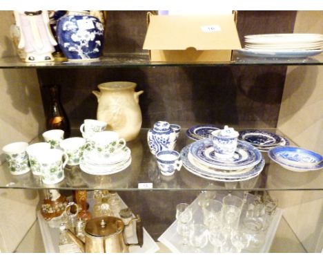 Shelf of predominately blue and white ceramics