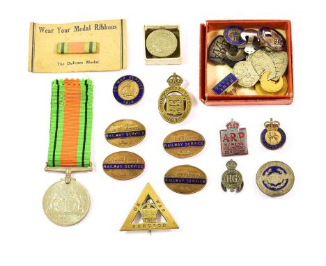 A Collection of Twelve Second World War Badges, including a silver ARP badge and two white metal examples, a Civil Defence la