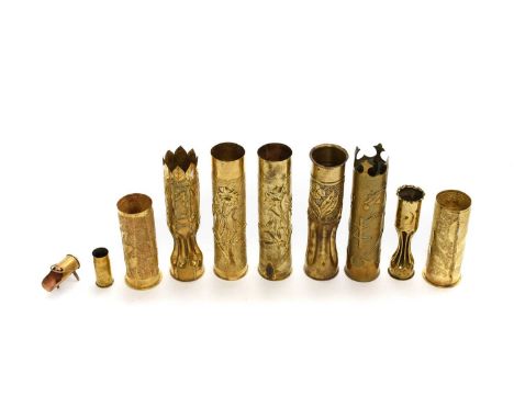 A Collection of Ten First World War Trench Art Brass Shell Cases, including a pair of US 75mm vases embossed with flowers on 