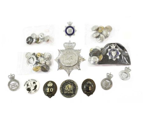 Leicestershire Constabulary:- two early 20th Century blackened helmet plate garter centres, a chrome die cast helmet plate wi