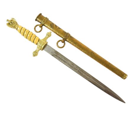 A Second World War German Kriegsmarine Dirk, the 24.5cm double edge steel blade etched with a fouled anchor and entwined dolp