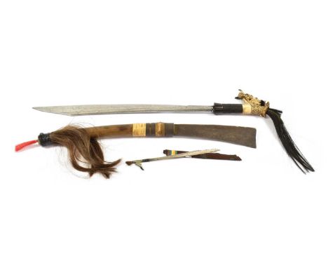 A Dyak Mandau (Head Hunter's Sword), Borneo, the 45cm clip point steel blade inlaid with copper dot motifs, the bone angled g