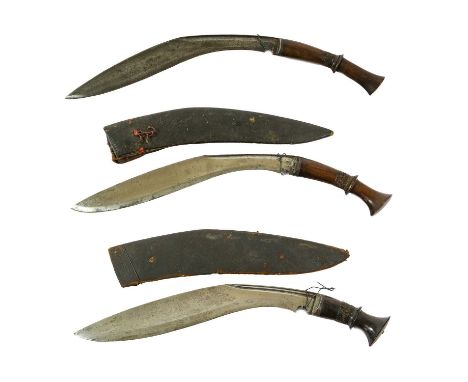 A Late 19th Century Nepalese Kukri, each side of the 33.5cm curved steel blade with two narrow fullers to the back edge and w