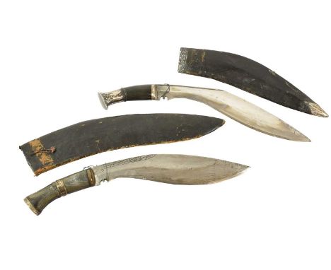 A Nepalese Kukri, each side of the 30cm curved steel blade with a narrow fuller to the back edge, the horn grip with silver b