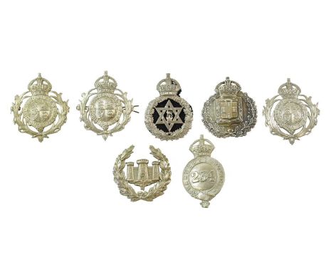 A Gibralter Police Helmet Plate, in die stamped white metal with wreath enclosing castle and key, with two fixing lugs; a Bar